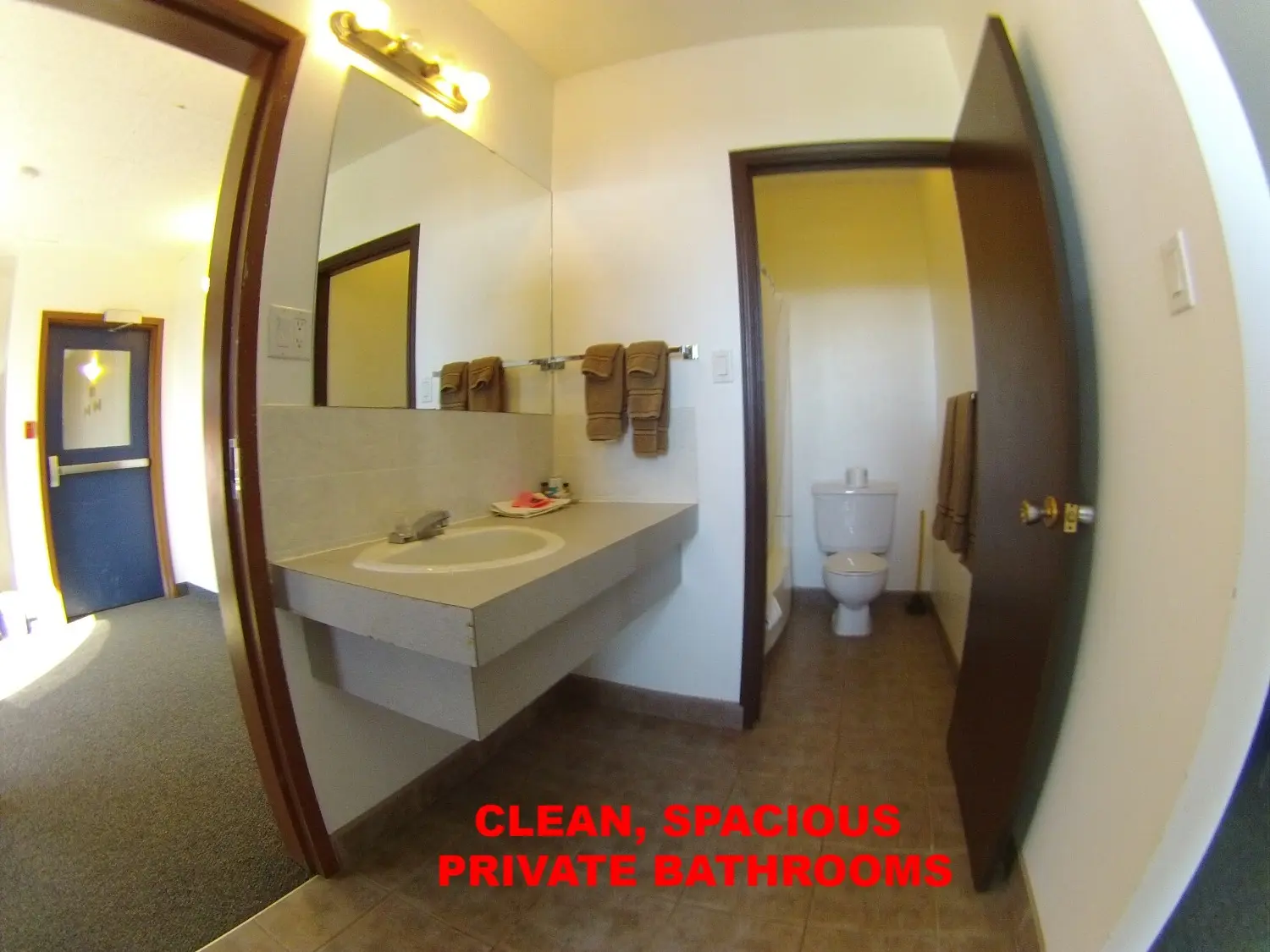 CLEAR_SPACIOUS_PRIVATE_BATHROOMS_VANITY_SINK_AND_MIRROR