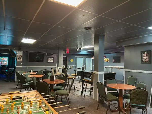 Indoor game room with foosball table and seating
