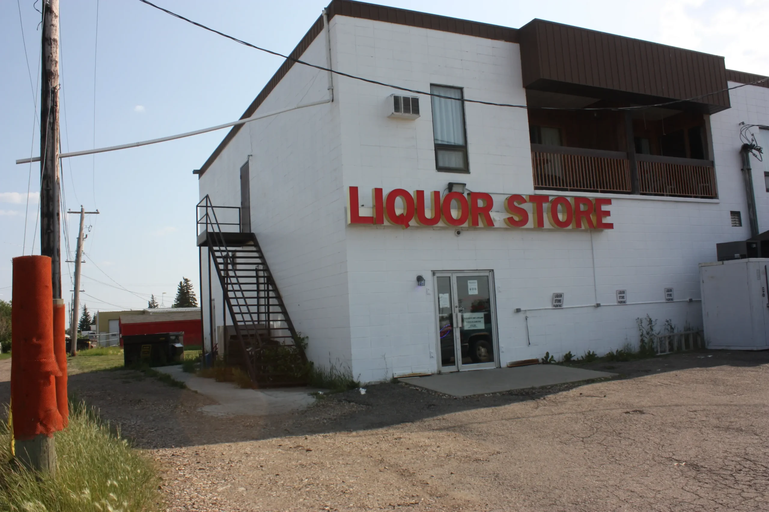 LIQUOR STORE sign on a white building