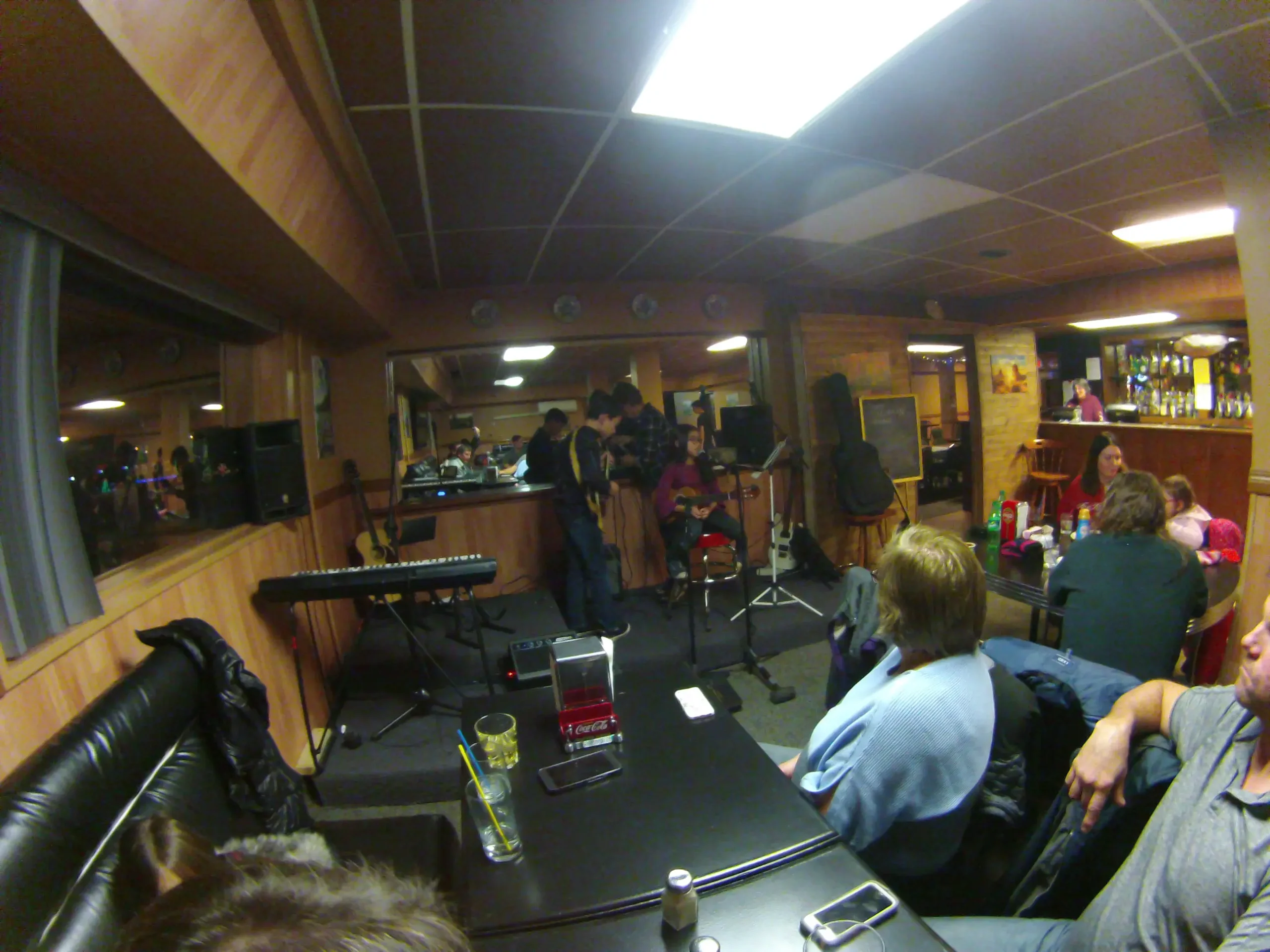 Live band performing for a crowd in a bar