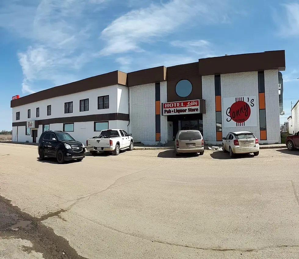 Rycroft hotel Alberta Canada with cars in parking lot