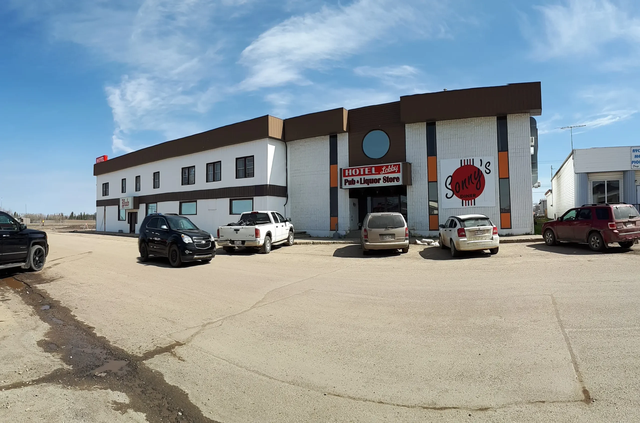 Two-story hotel in Rycroft Alberta with a parking lot